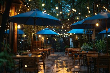 Cozy Outdoor Cafe Terrace Decorated with Lights and Plants