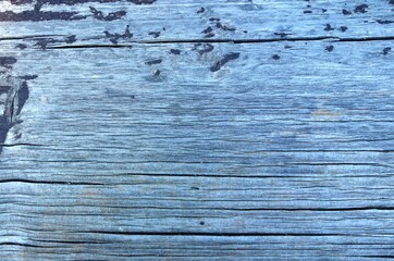 Wooden board with brown paint damaged under the weather conditions