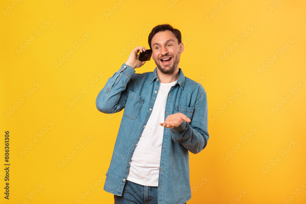 Poster a man is holding a cell phone up to his ear, engaging in a phone conversation. he appears focused an