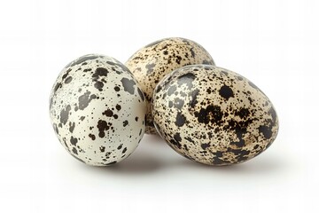 Obraz premium Three Speckled Quail Eggs Isolated on White Background