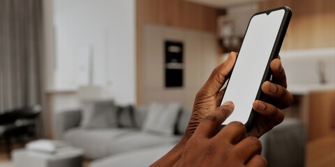 African-American Hand with smartphone in modern home, perfect for smart home app