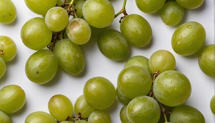 Green grapes on a white background, close-up, top view