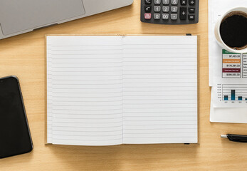 Open blank notebook in workplace top view