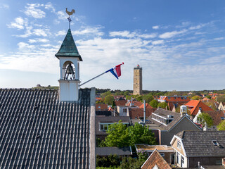 Aerial drone image of a bell tower of an historic church in the old town of West Terschelling with...