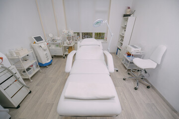 The interior of the massage and cometology salon, massage table. Nobody.