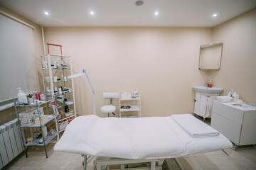 The interior of the massage and cometology salon, massage table. Nobody.