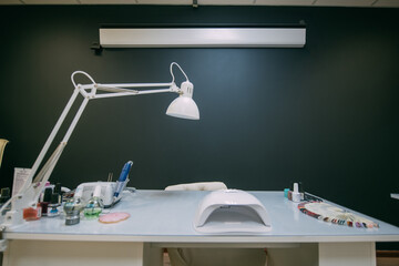 The interior of the nail salon without people. A bright, modern salon for the care of nails