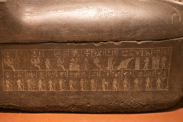 Egyptian hieroglyphs on a stone in a tomb close-up