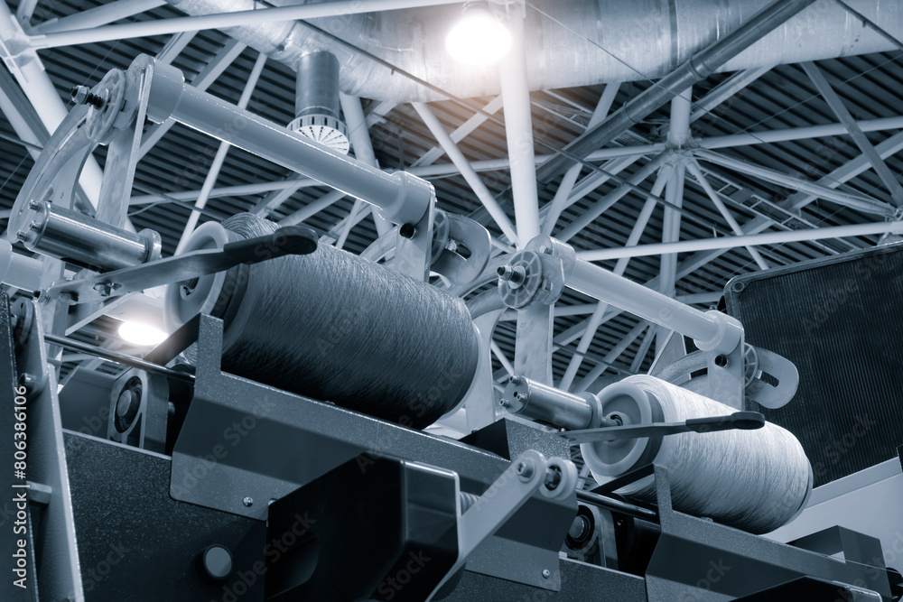 Poster A machine with two rollers is in a factory