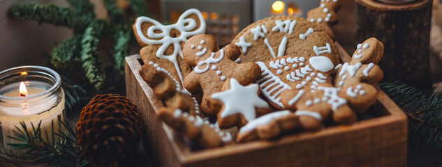 Traditional holiday homemade gingerbread cookies in a vintage wooden box. Craft paper with...