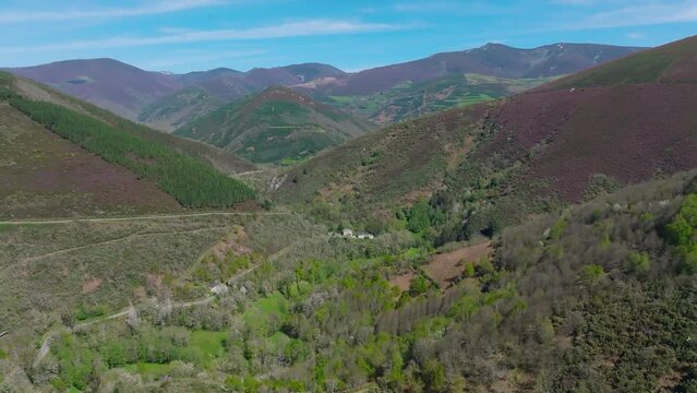 Aerial shot of Mountain Range landscape with green forests from Doiras in Galicia, Spain in summer