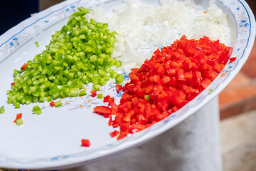 green bell pepper, red bell pepper and onion chopped in small cubes. Cooking concept