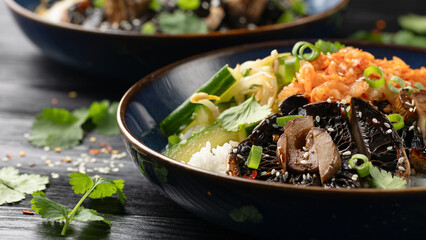 Korean mushrooms bowl with cucumber salad, kimchi and rice