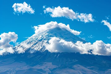 A majestic mountain peak covered in snow, surrounded by fluffy white clouds against the blue sky. Chimborazo Day. - Powered by Adobe