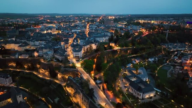 4K Aerial view of a Grand Duchy of Luxembourg , city skyline to night at Grund along Alzette river in the historical old town of Luxembourg