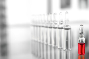Vaccine vials on glass table in doctor's office