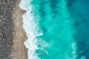 Fototapeta na wymiar Sea and beach aerial view. Top view, amazing nature background. Beautiful beach of white sand surrounded by crystal clear water. Waves on the beach. Travel and vacation concept
