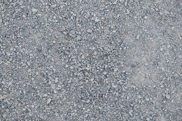 A frame filled with Gravel way the textured surface of finely crushed stone on the walking path
