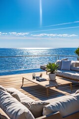a spacious deck area with comfortable loungers, a sleek coffee table, and a panoramic view of the sparkling ocean. The minimalist yet stylish design creates a relaxing and luxurious atmosphere 