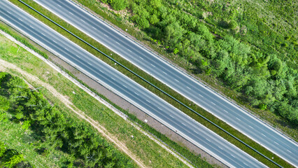 Aerial View of Highway Cutting Through Forest
