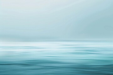 Obraz premium Azure Horizon: Calm Blue Ocean Meeting the Sky's Whispering Clouds.