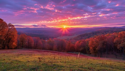 Rolling hills ablaze with the colors of autumn, stretching beneath a vibrant sunset sky © AhmadTriwahyuutomo