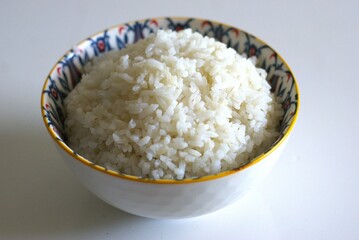 Close up image of A bowl of rice on white background