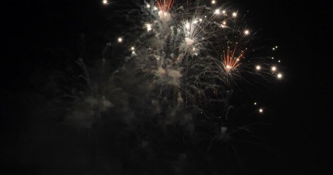 Golden Firework celebrate anniversary happy new year 2024, 4th of july holiday festival. Gold firework in the night time celebrate national holiday. Countdown to new year 2025 gold party time event