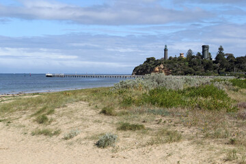 Queenscliff foreshore with a beach, ocean, lighthouse and pier in Victoria, Australia