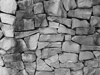 Black and white of stone wall texture. Stone wallpaper.