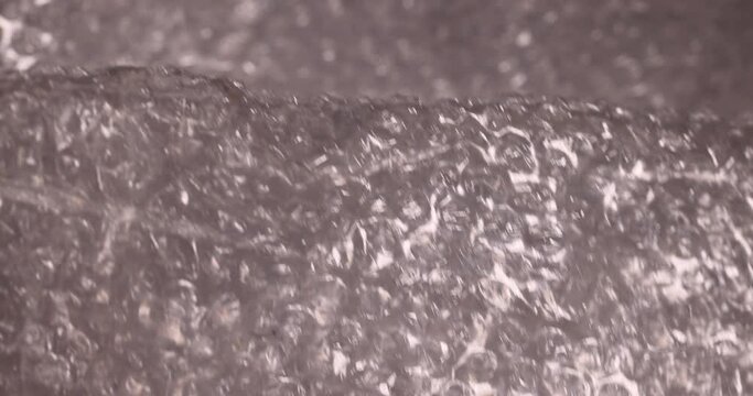 old air cellophane with a lot of bubbles for safe storage of things, close-up of a protective film with air bubbles