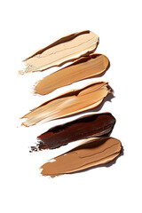 Closeup of various foundation makeup shades isolated on white