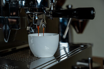 making delicious espresso coffee with professional machine