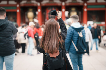 Tourist woman visit Sensoji Temple or Asakusa Kannon Temple is a Buddhist temple located in...