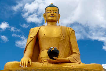 Colorful golden Buddha statue at the Stok Buddhist Monastery in northern India