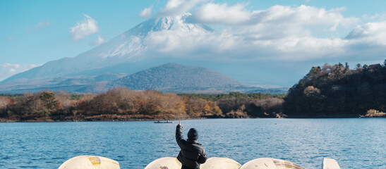 Woman tourist enjoy with Fuji Mountain at Lake Shoji, happy Traveler sightseeing Mount Fuji and...