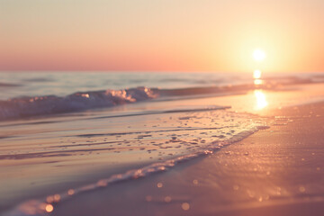 Fototapeta premium Depicting the allure of a sunset on the horizon with a close-up shot of the sun dipping below the sandy beach, painting the sky in a myriad of colors