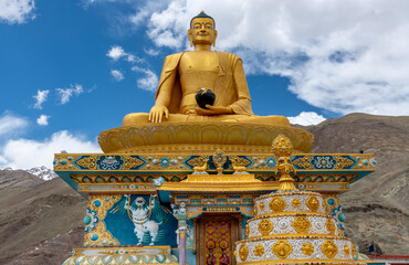 Colorful golden Buddha statue at the Stok Buddhist Monastery in northern India