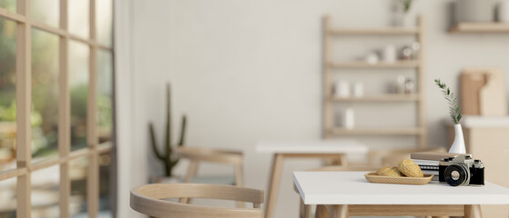 A table with decor in a minimalist contemporary coffee shop or restaurant.