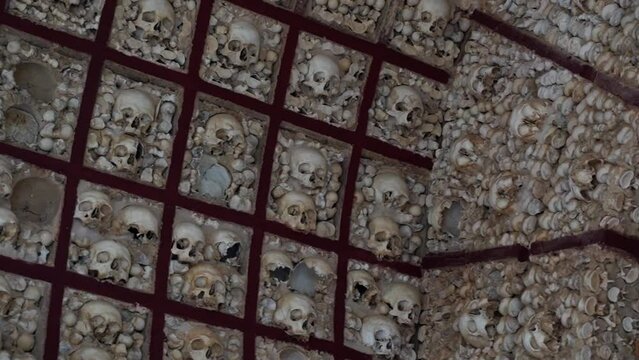 Capela dos Ossos (Bone Chapel) In Faro, Portugal; Exhumed Bones And Skulls Decorating The Chapel Wall.