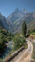 A mountain range with a road leading to it