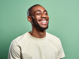 Fototapeta premium A man with a white shirt is smiling and looking at the camera