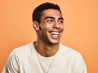 Fototapeta premium A man with a smile on his face is wearing a white shirt and a necklace