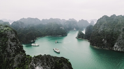 Limestone Mountains of Vinh Bai Tu Long - Ha Long Bay, Vietnam with Junkboats and Cruise Ships -...