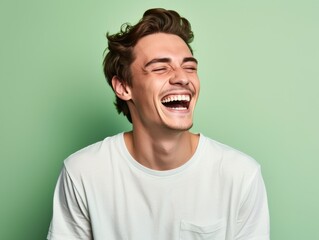 A man with is smiling and laughing