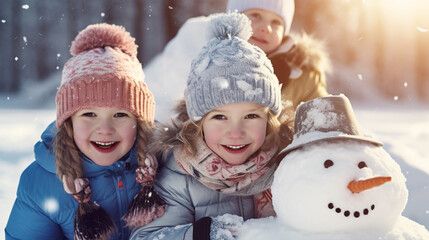 Children play outdoors in snow. Outdoor fun for family Christmas vacation.  happy kids  in colorful clothes playing outdoors in the christmas snow