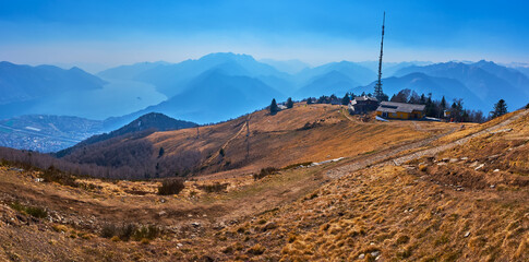The hazy scenery from Cardada Cimetta Mount summit, Ticino, Switzerland