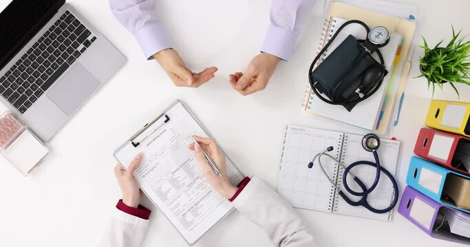 Consultation of doctor and patient hand gestures communicating top view