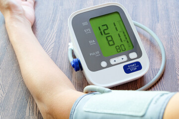Man check blood pressure monitor and heart rate monitor with digital pressure gauge. Health care...