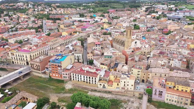 Summer view from drone of center of medieval Spanish town of La Bisbal d Emporda with episcopal palace castle and Church of Santa Maria, province of Girona, Catalonia